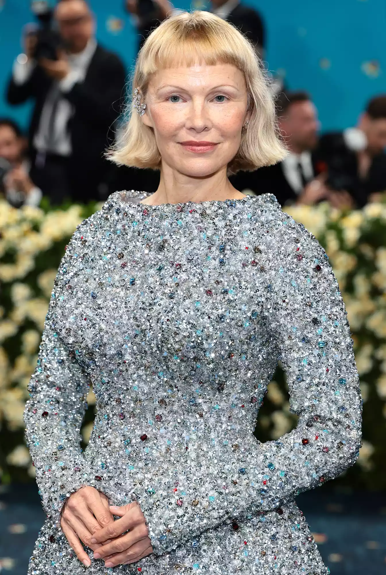 Pamela Anderson, Met Gala 2025, Tory Burch, baby bangs, lab-grown diamonds, Pandora jewelry, red carpet fashion, celebrity style, minimalist makeup, sustainable 
